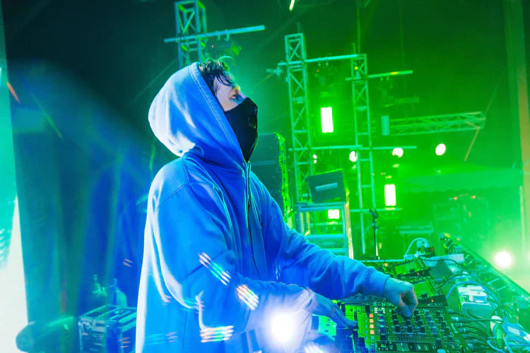 Alan Walker commanding the stage in the Blue Hoodie, a glimpse into the electrifying world of Walker's music events.