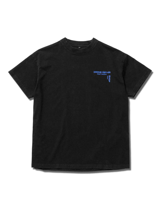 Black Alan Walker's Drone Repair Shop T-shirt with blue logo text on the left chest area, laid flat on a white background.