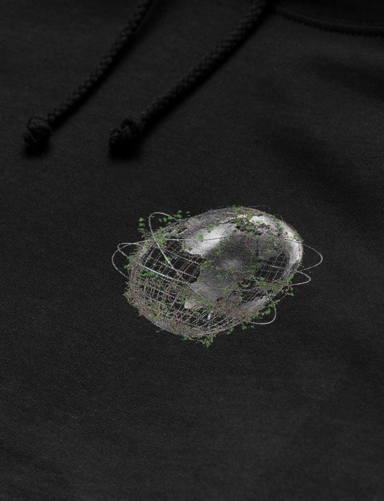 Detailed image of the planet emblem on Alan Walker's 'World We Used To Know' hoodie.