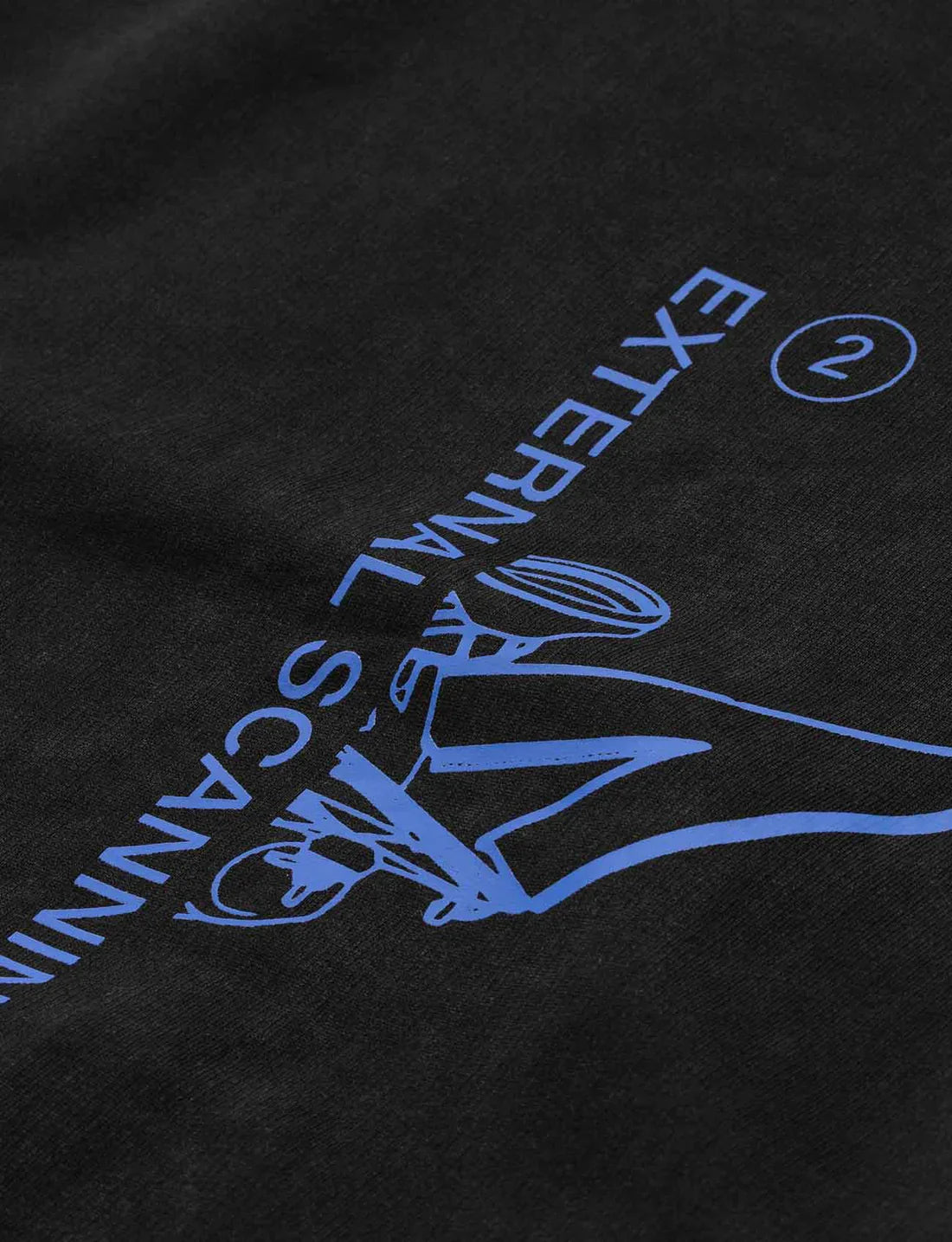 Close-up of the backside of a black hoodie with blue graphic text angled downwards, showcasing the 'Drone Repair Shop' design detail.