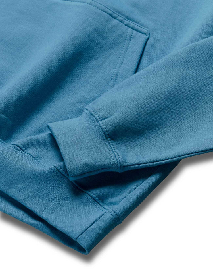 Detail of the Blue Walker Stage Hoodie's sleeve cuff, highlighting the soft fabric and snug fit perfect for active fans.