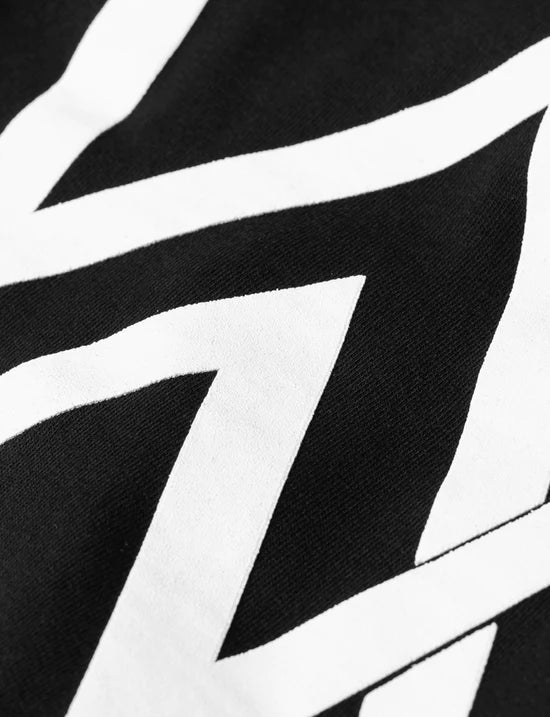 Close-up of the striking white Alan Walker logo on the back of the kids black hoodie, showcasing the brand.