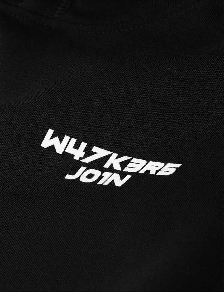 Close-up of the 'W4LK3RS JOIN' text printed in white on the front chest area of the Alan Walker Core Logo Hoodie, showcasing the brand's community call-to-action on a black fabric background.