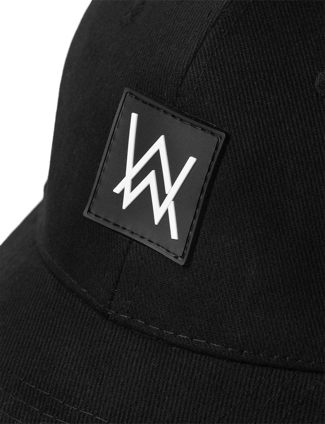 Close-up of the Alan Walker Core Logo Cap's front, highlighting the white 'AW' logo on a black square patch against the cap's black fabric, detailing the stitching and texture.