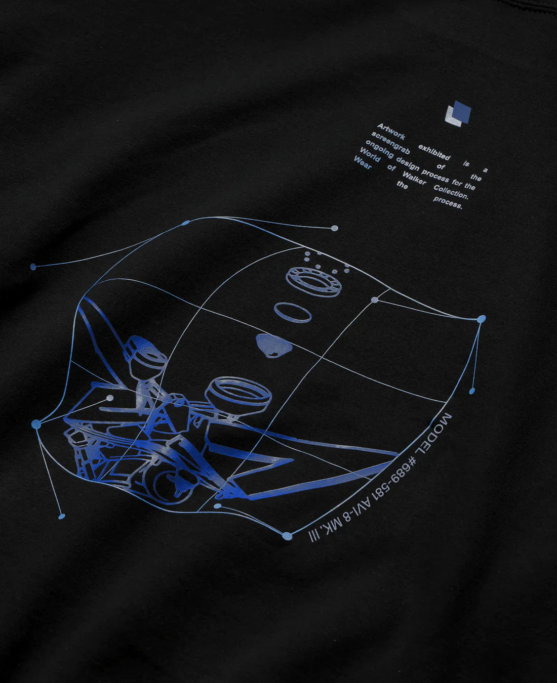 Rear close-up view of Alan Walker Blueprint Hoodie featuring intricate blueprint graphic design in blue on black fabric, illustrating the creative process of the Walker Wear Collection.
