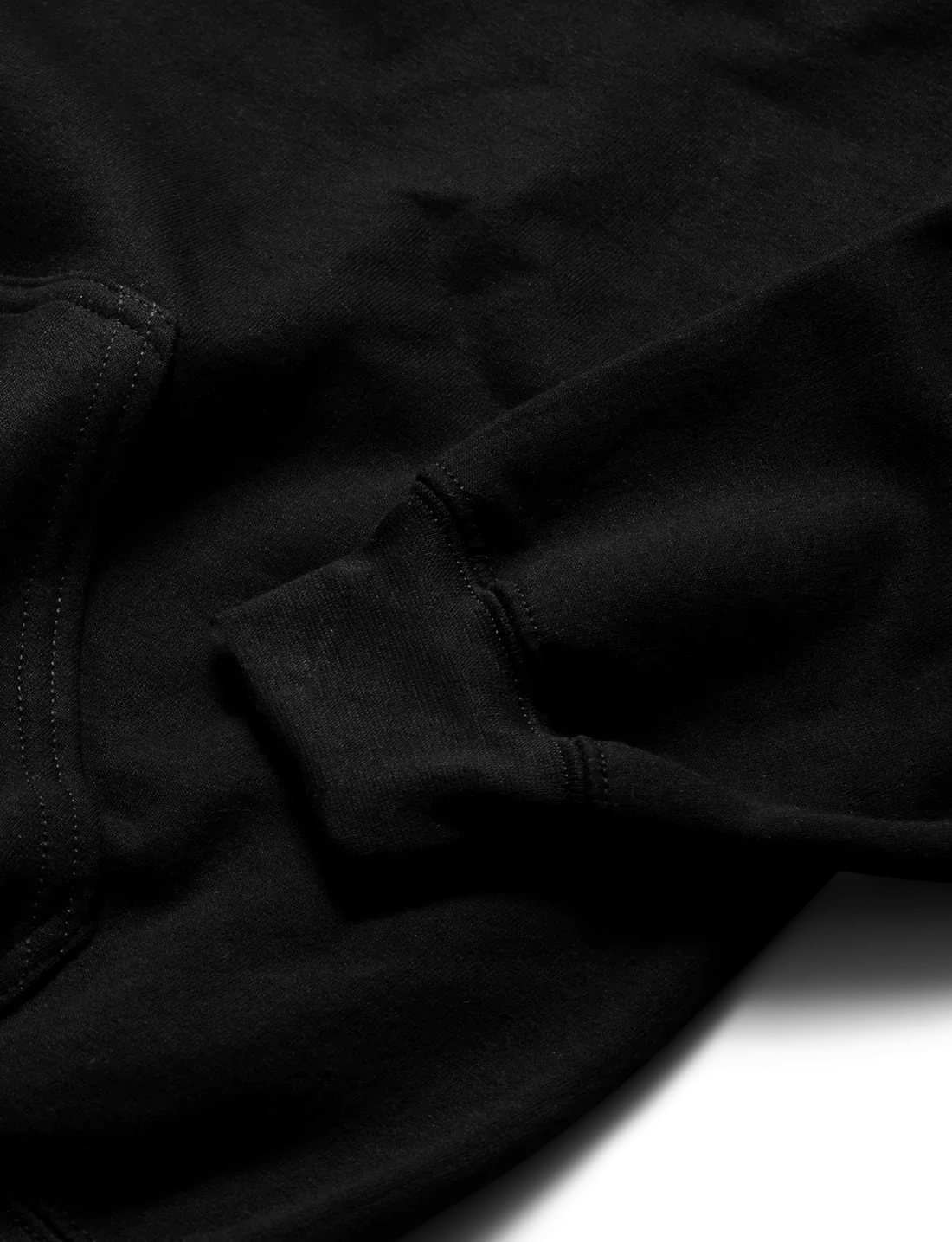 Textured detail of Alan Walker Blueprint Hoodie showcasing the quality black fabric and fine stitching around the cuff, exemplifying the garment's craftsmanship.