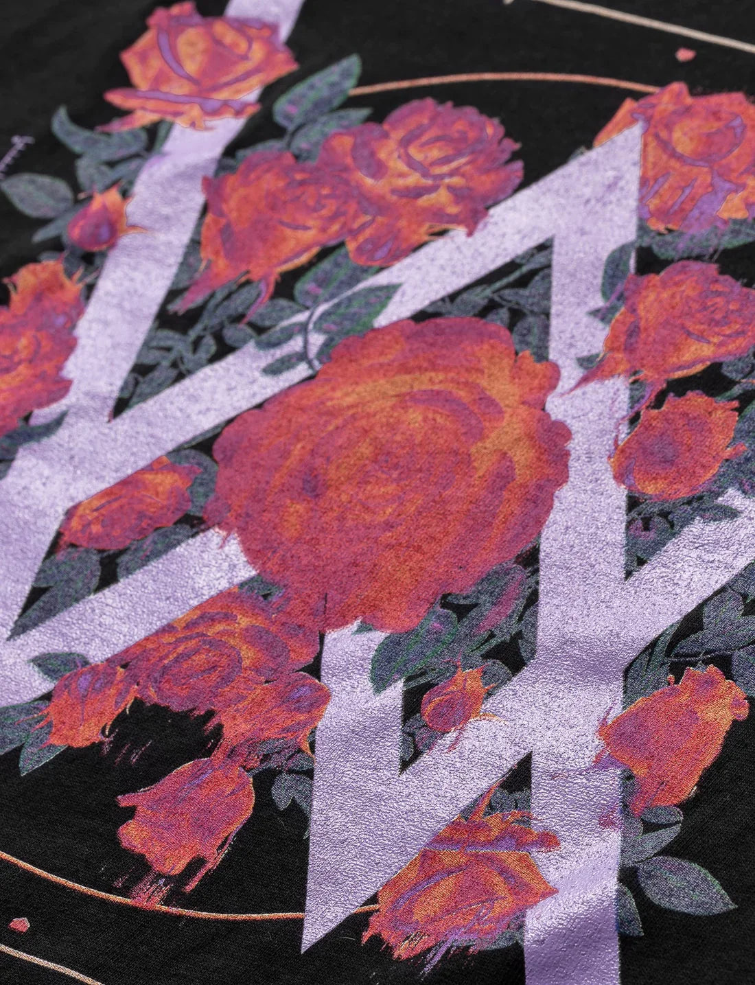 Zoomed-in texture detail of the melting rose graphic on the back, blending music and botanical elements in this Alan Walker hoodie.