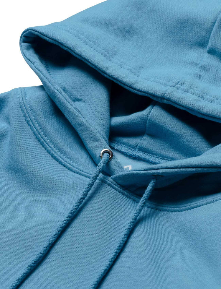 Close-up of the blue hoodie's hood with quality stitching and durable drawstrings, designed for Alan Walker's stage performances.