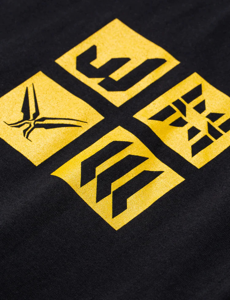 Detailed close-up of the Black Walkerverse 2.0 Longsleeve's symbolic yellow print, a nod to Alan Walker's distinctive branding.