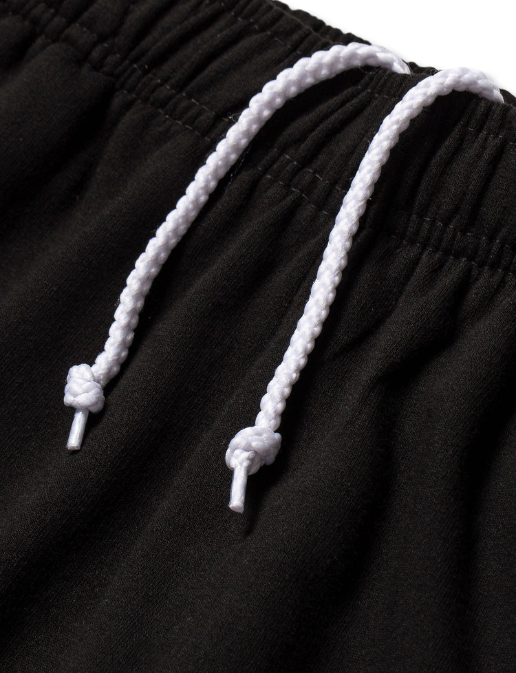 High-quality craftsmanship of the Black Walkerverse 2.0 Sweatpants with sturdy white drawstrings for a comfortable fit.