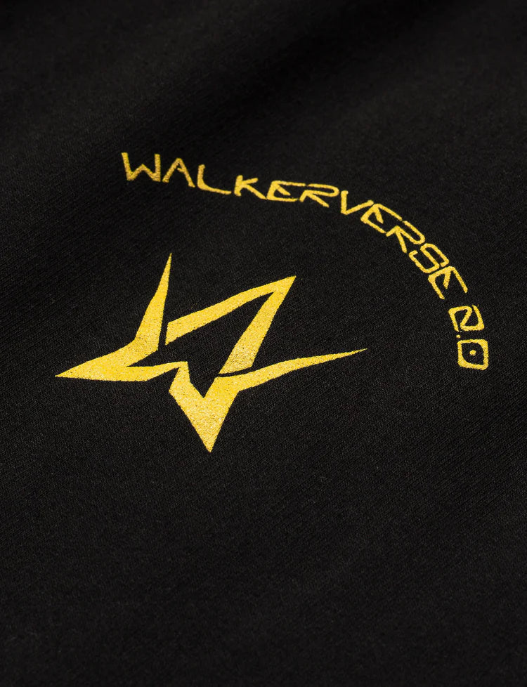 Detailed view of the Black Walkerverse 2.0 Sweatpants showing the vibrant yellow Walkerverse 2.0 logo.