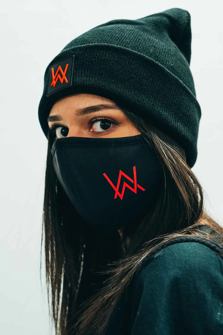 Casual winter fashion highlighted by a black Alan Walker branded face mask with a striking red logo.