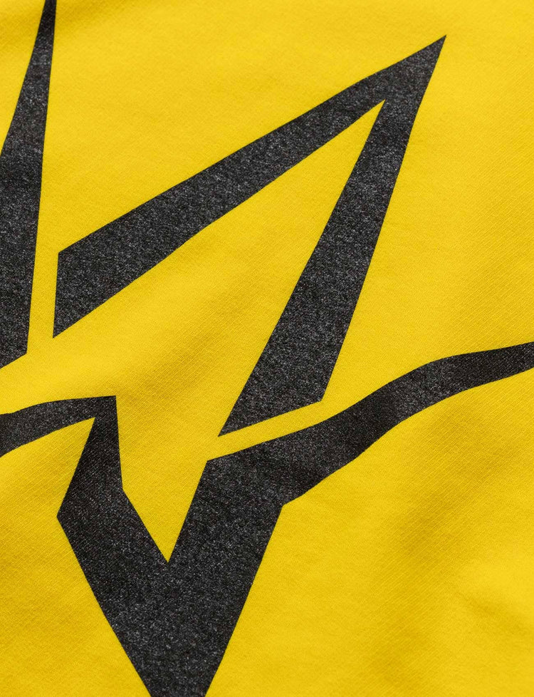 Zoomed-in view of the bold black Alan Walker symbol on the Yellow Walkerverse Hoodie.